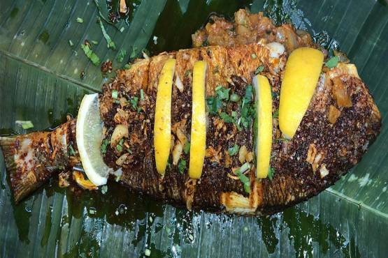 Pan Fried whole sea bass in Banana Leaf (Meen Pollichathu )